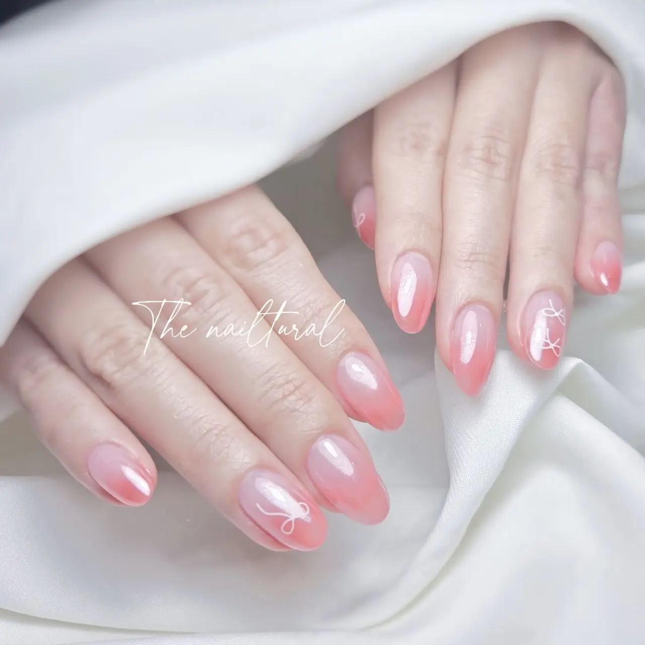 oval-shaped nails, ribbon milky white that seamlessly delicate pink and white gradient design, translucent pink